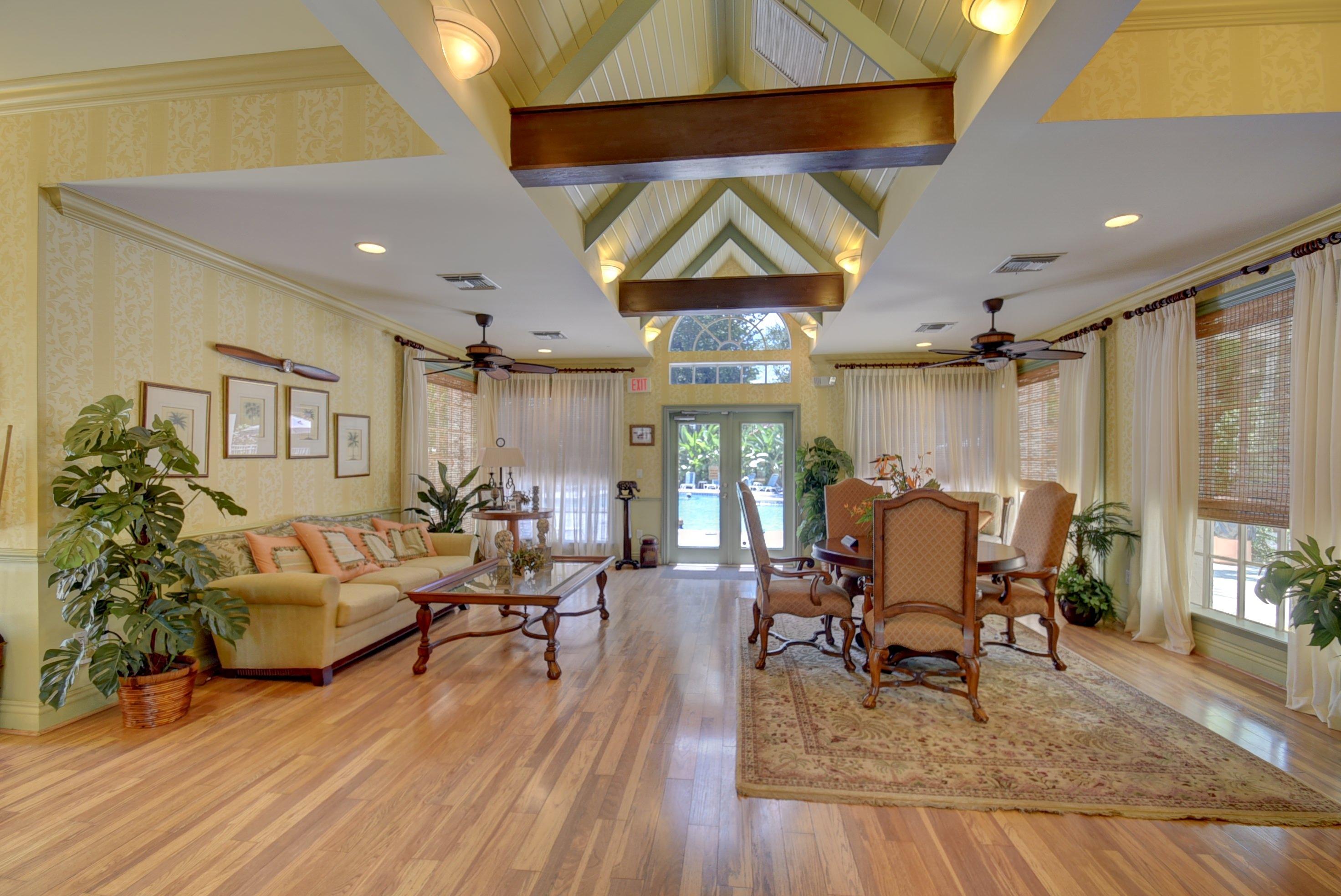 1275 Crystal Way, Unit B Delray Beach, FL 33444 - Photo 36 of 37 a living room with fireplace furniture and a wooden floor