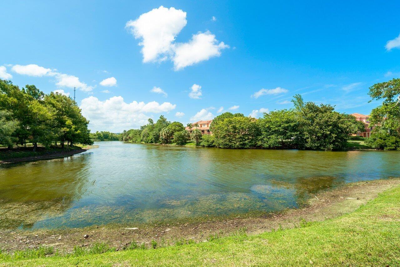 1275 Crystal Way, Unit B Delray Beach, FL 33444 - Photo 37 of 37 a view of a lake with houses in the background