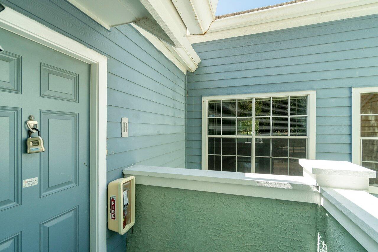 1275 Crystal Way, Unit B Delray Beach, FL 33444 - Photo 4 of 37 a view of a house with a large window