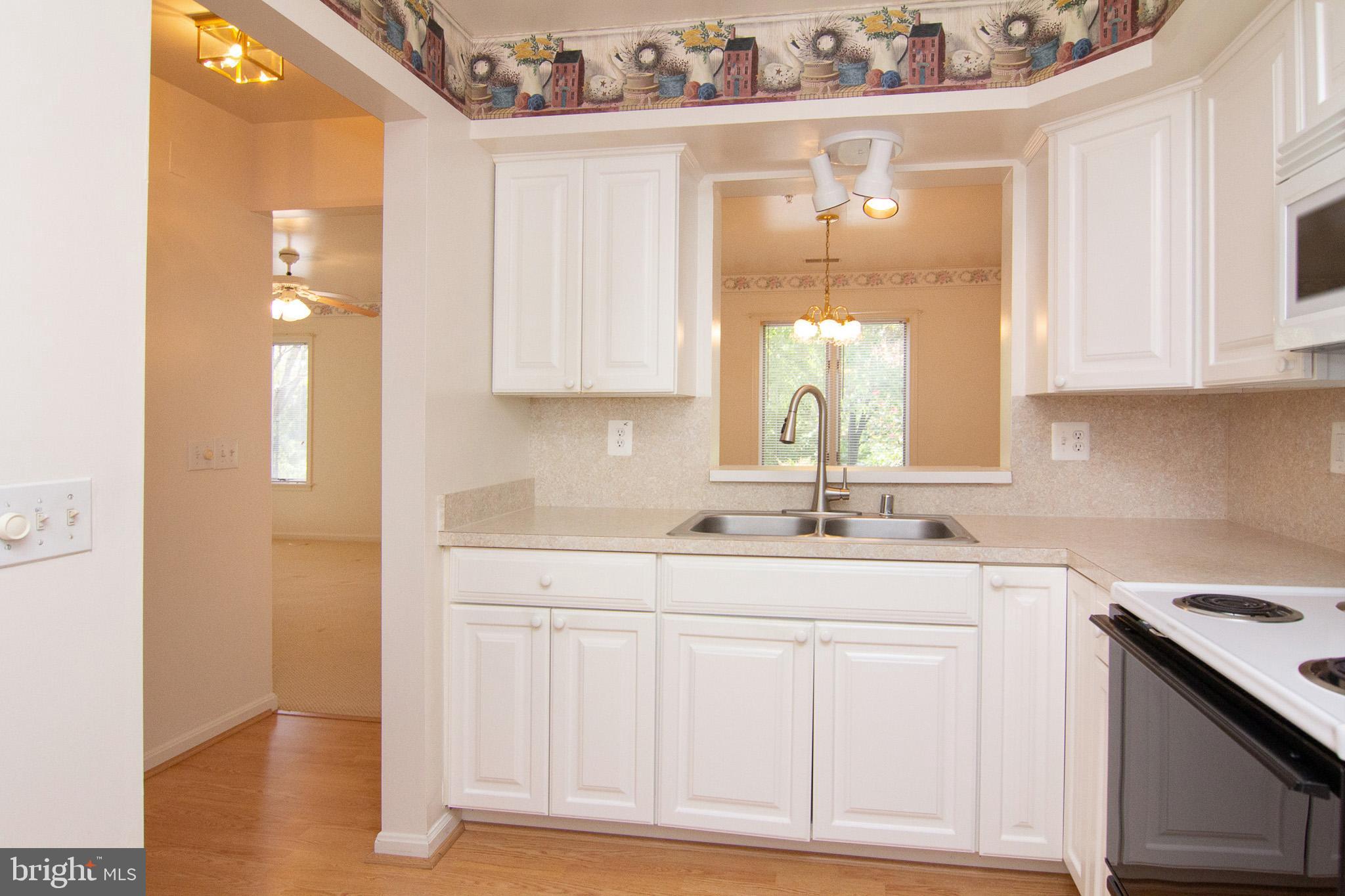 425 Pleasanton Road, Unit C14 Westminster, MD 21157 - Photo 9 of 28 Kitchen is 11 x 8 and has laminate floor