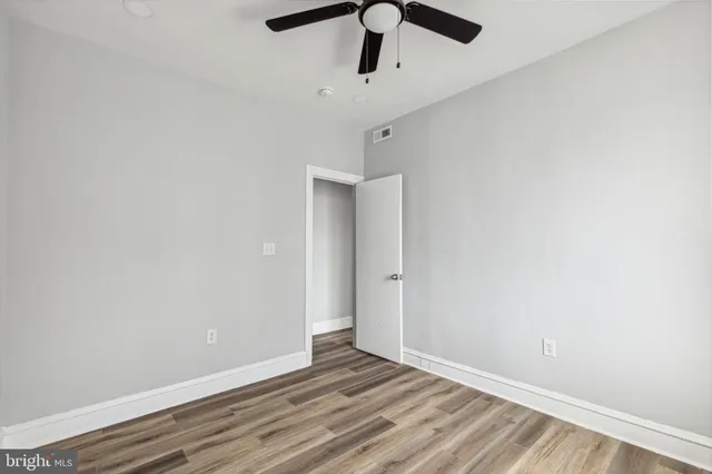 a bathroom with a sink toilet and a mirror