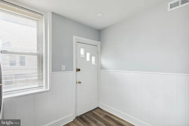a kitchen with stainless steel appliances granite countertop a refrigerator stove and sink