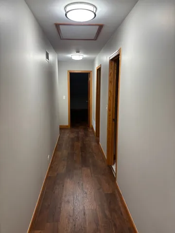 a view of gallery with wooden floor