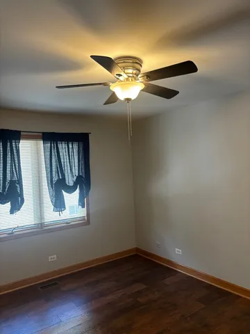 a view of wooden floor in an empty room