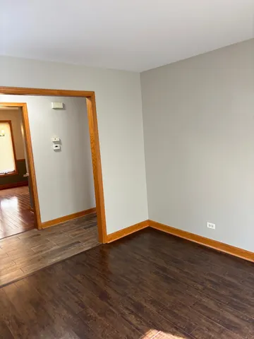 a view of wooden floor in an empty room