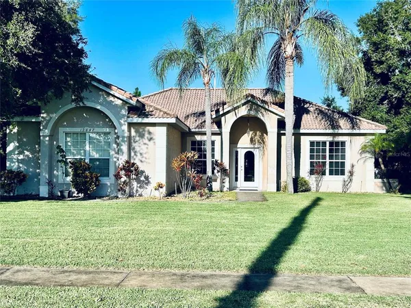 a view of a house with yard and front view of a house