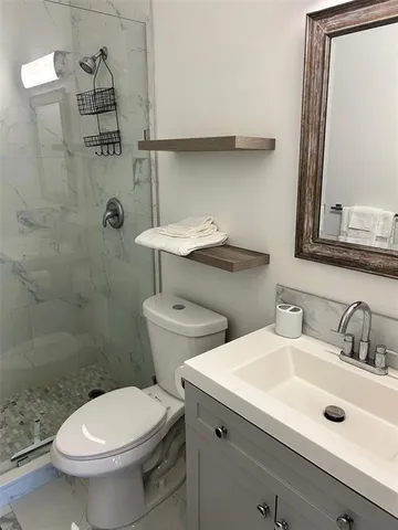 a bedroom with a bed and windows