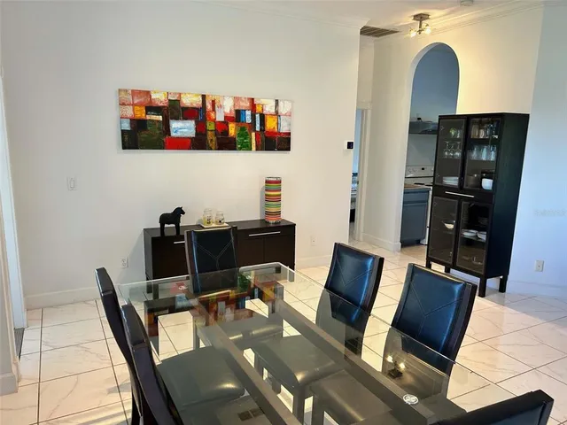 a living room with furniture fireplace and rug