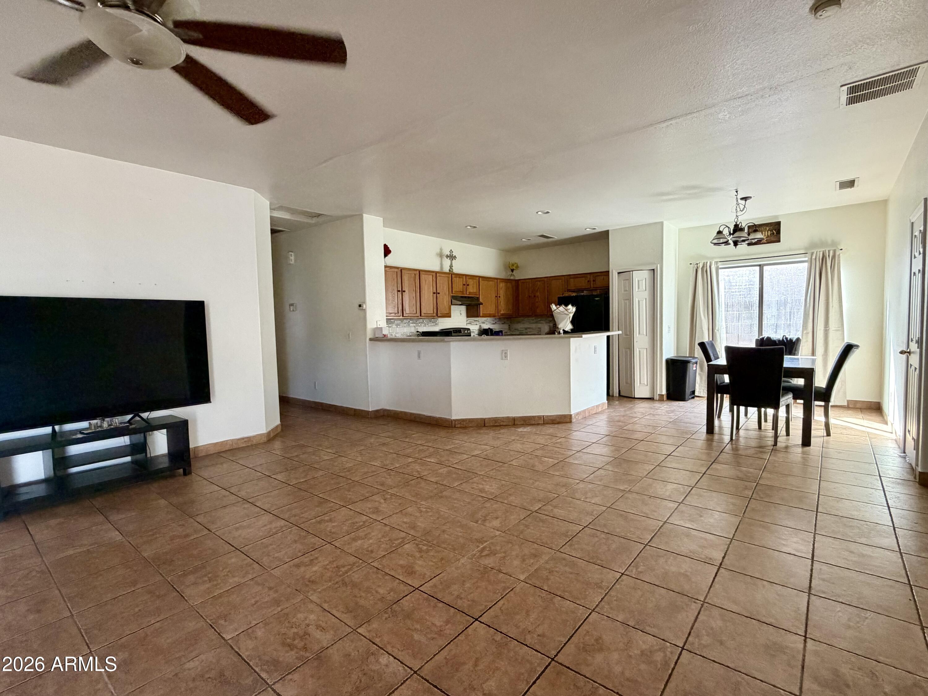 506 West Del Rio Lane Avondale, AZ 85323 - Photo 2 of 7 Living Dining Kitchen