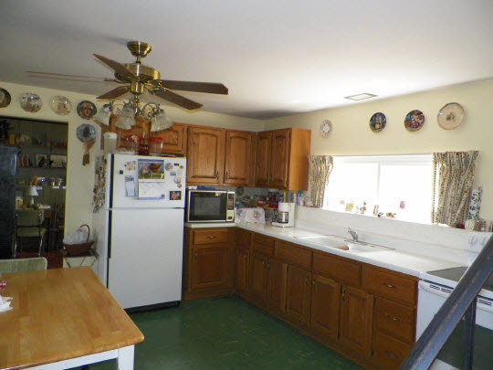 9065 Cunningham Road Winnebago, IL 61088 - Photo 5 of 6 a kitchen with a sink appliances and cabinets