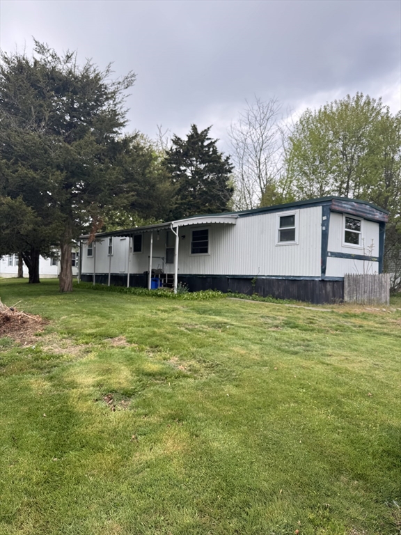 301 Bulgarmarsh Road Tiverton, RI 02878 - Photo 1 of 2 a view of a house with a yard