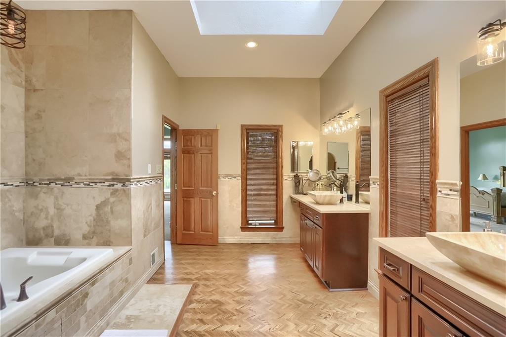 325 Overbrook Road Valencia, PA 16059 - Photo 27 of 34 a bathroom with a tub a sink and mirror