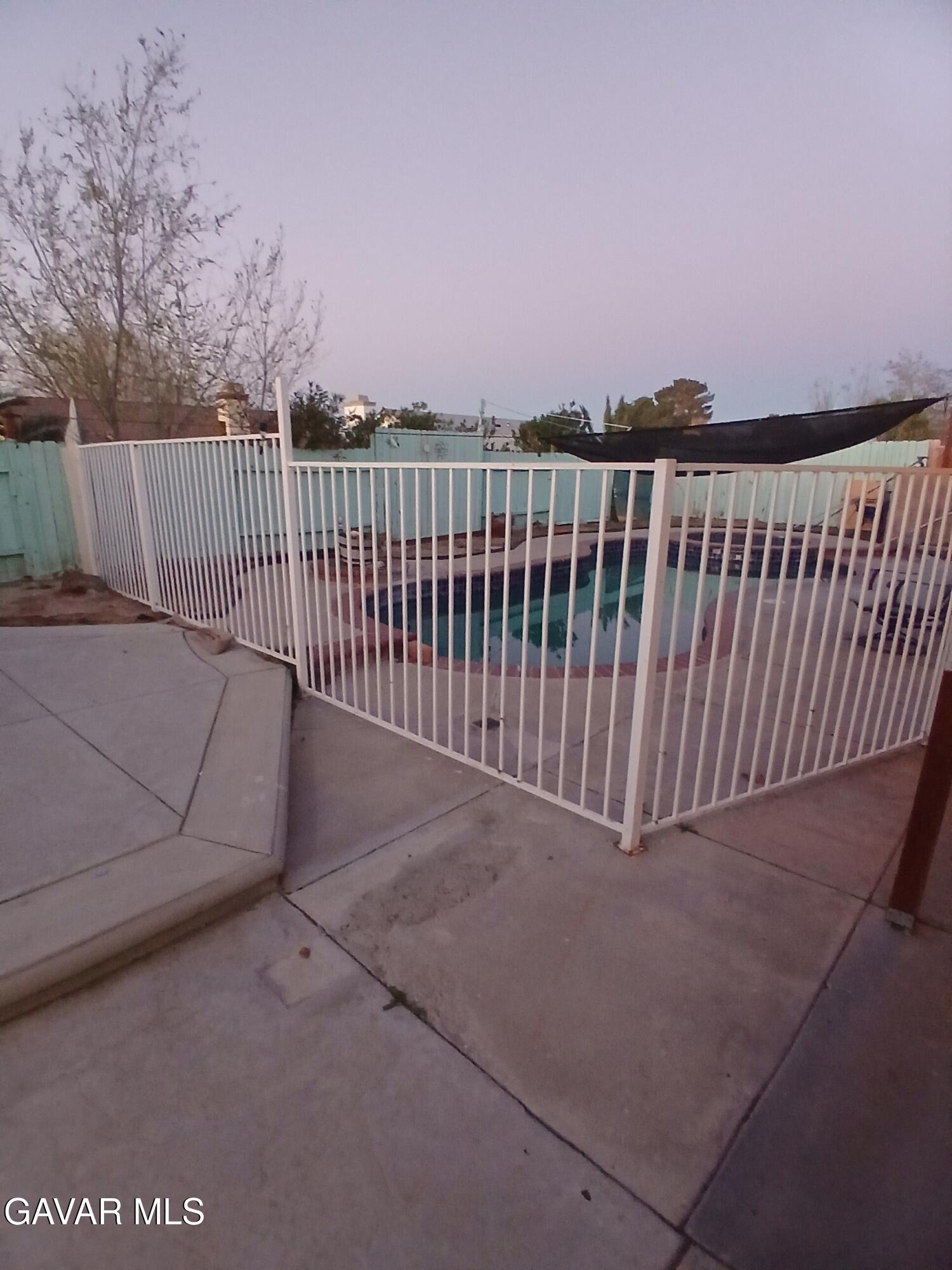4111 Saddleback Road Palmdale, CA 93552 - Photo 16 of 23 a view of a balcony with wooden fence