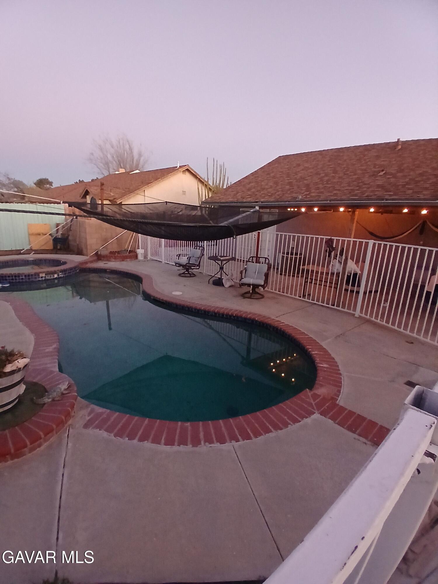 4111 Saddleback Road Palmdale, CA 93552 - Photo 17 of 23 a view of roof deck with table and chairs