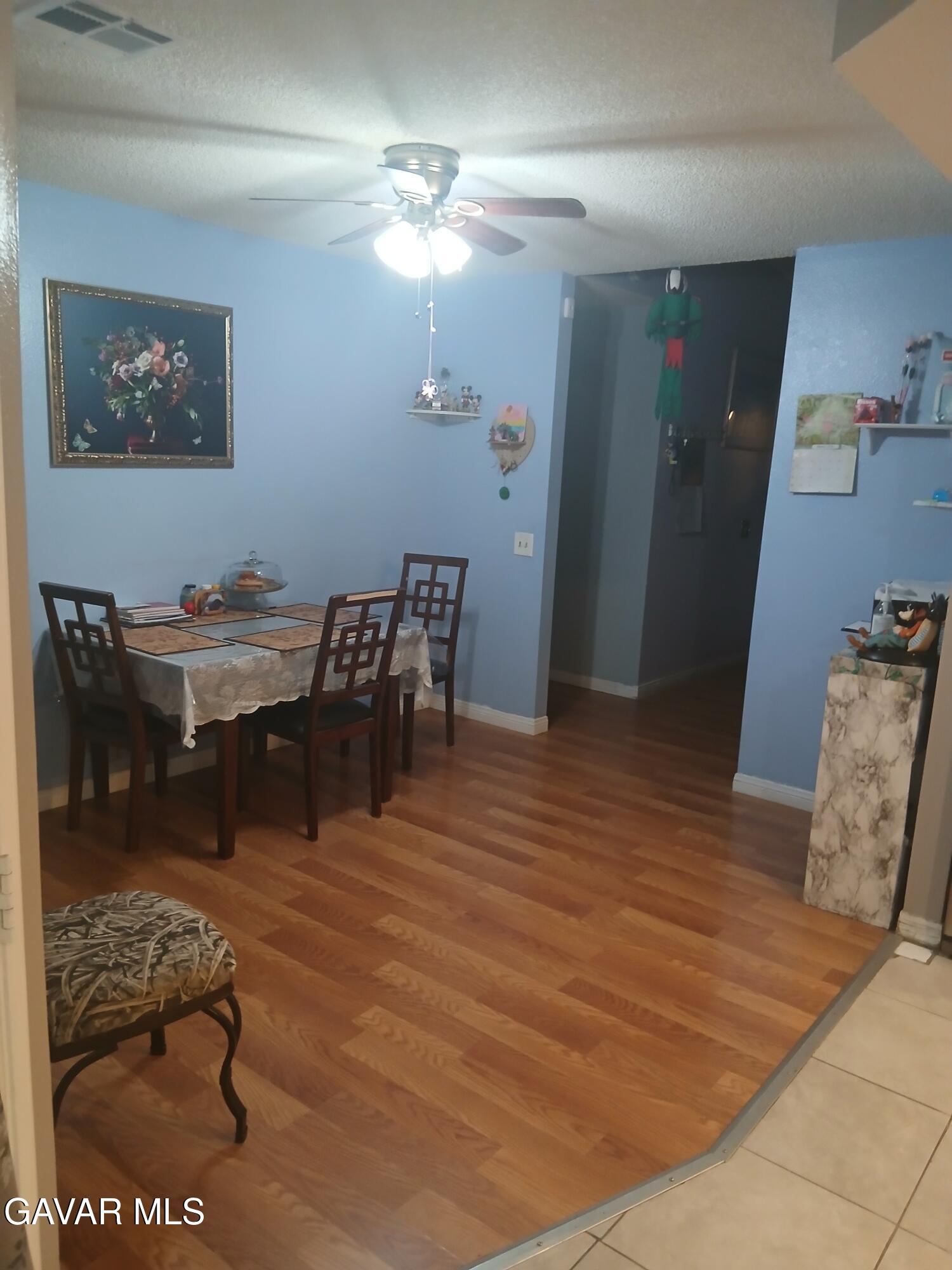 4111 Saddleback Road Palmdale, CA 93552 - Photo 7 of 23 a view of a dining room with furniture