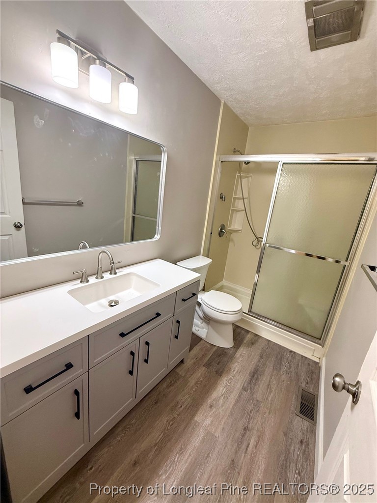 741 Newport Road Fayetteville, NC 28314 - Photo 11 of 48 a bathroom with a double vanity sink toilet and mirror
