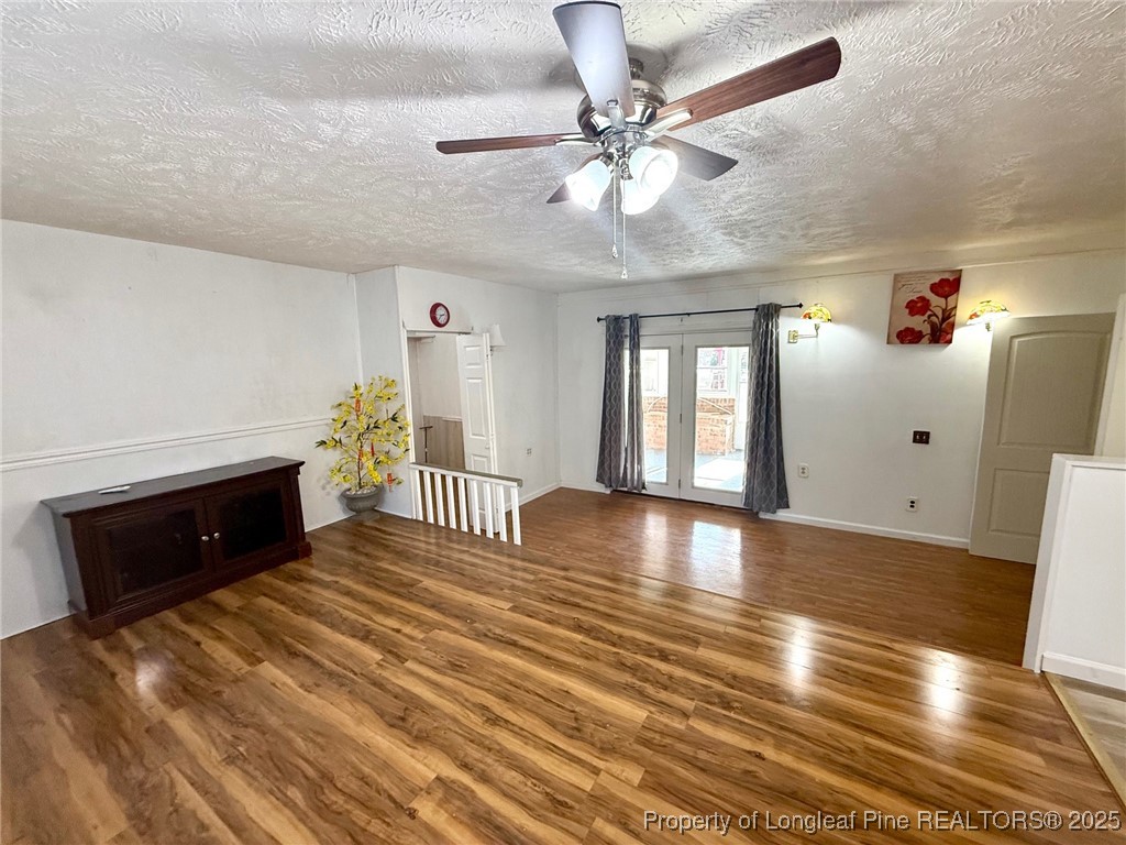 741 Newport Road Fayetteville, NC 28314 - Photo 22 of 48 a view of a livingroom with a furniture wooden floor and chandelier