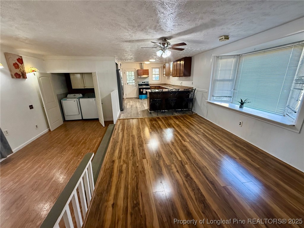 741 Newport Road Fayetteville, NC 28314 - Photo 23 of 48 a view of a living room with wooden floor