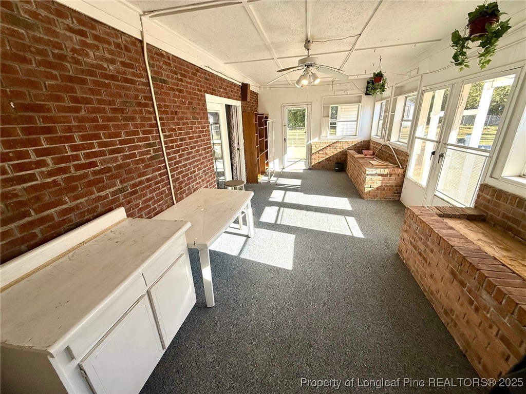 741 Newport Road Fayetteville, NC 28314 - Photo 28 of 48 a view of a patio with couches and potted plants