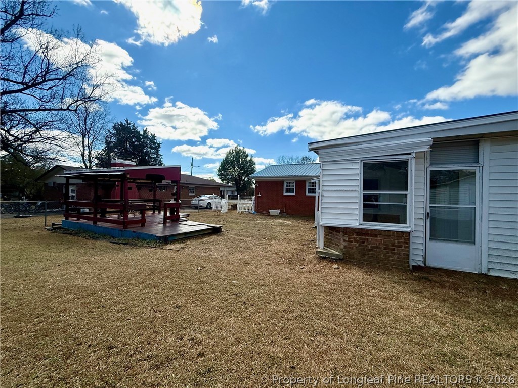 741 Newport Road Fayetteville, NC 28314 - Photo 32 of 48 a view of house with outdoor space and car parked