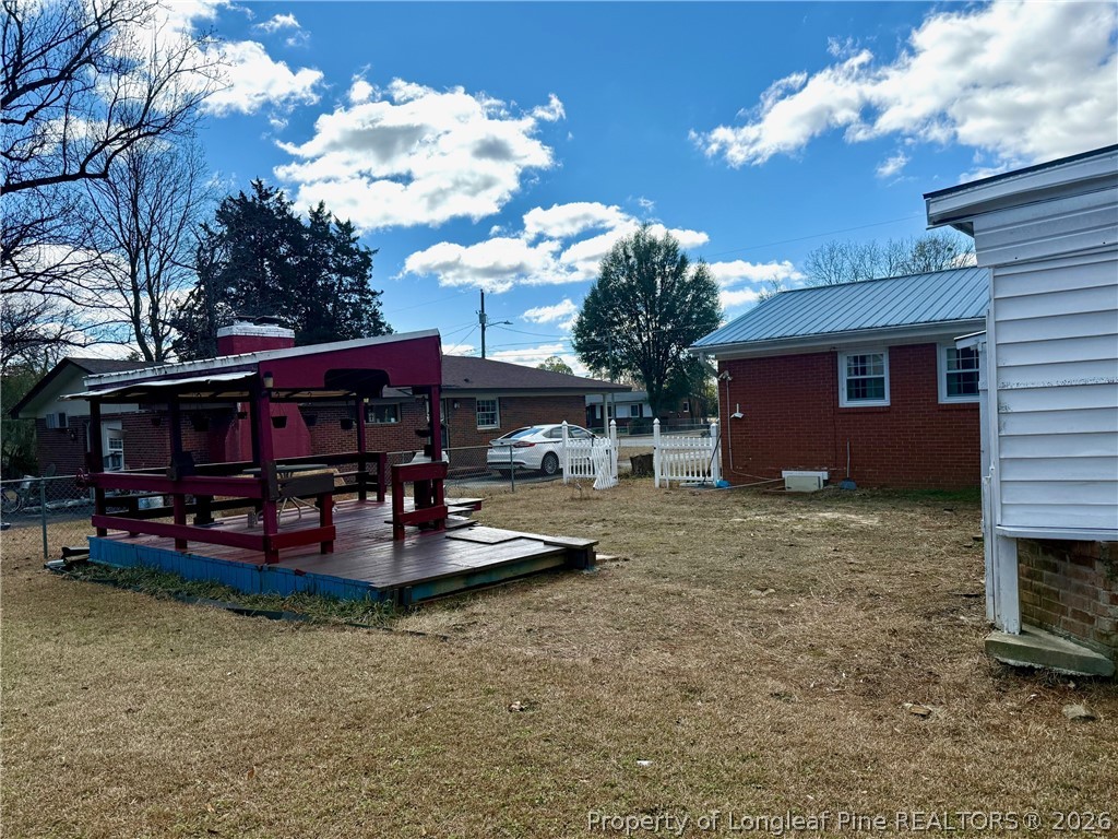 741 Newport Road Fayetteville, NC 28314 - Photo 34 of 48 a view of a house with backyard porch and sitting area