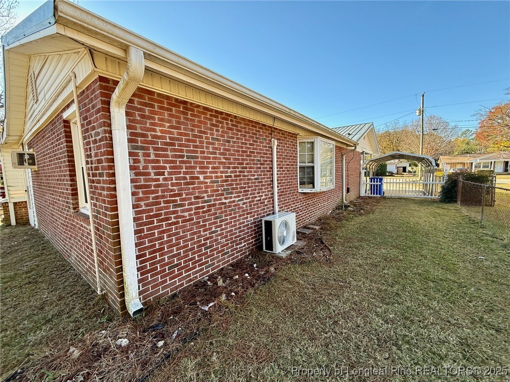 741 Newport Road Fayetteville, NC 28314 - Photo 38 of 48 a view of a house with backyard and porch