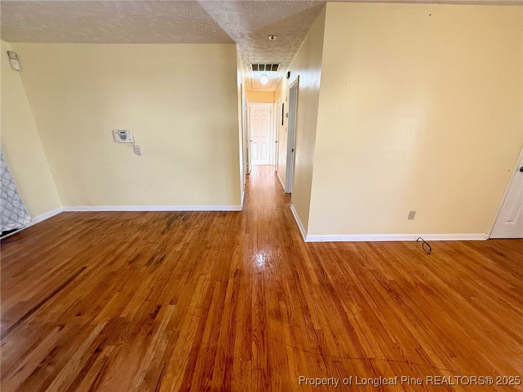 741 Newport Road Fayetteville, NC 28314 - Photo 8 of 48 a view of a room with wooden floor