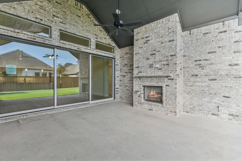 224 Bee Balm Road McKinney, TX 75071 - Photo 11 of 20 a view of an empty room with a fireplace