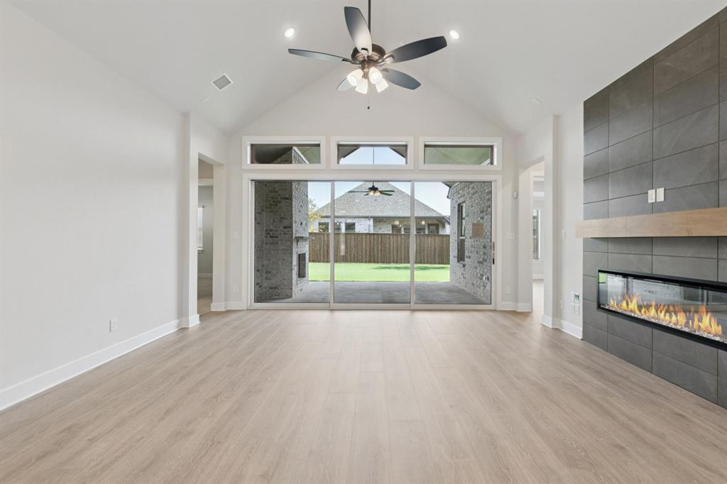 224 Bee Balm Road McKinney, TX 75071 - Photo 6 of 20 wooden floor in an empty room with a window
