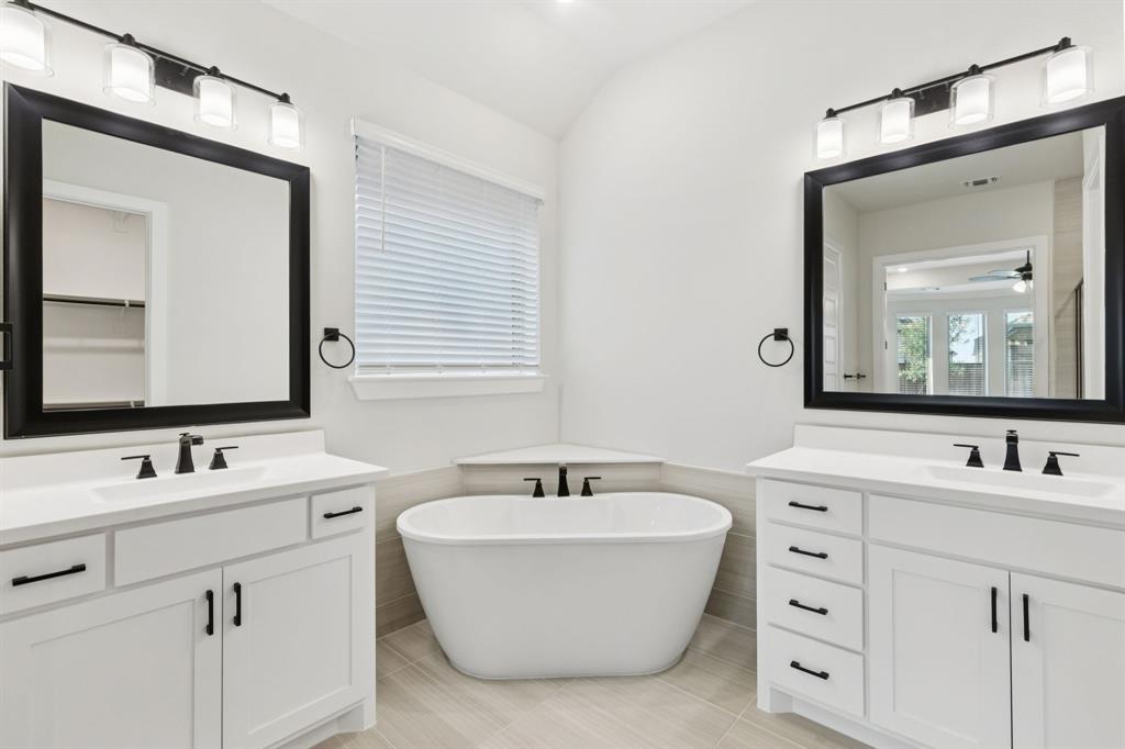 224 Bee Balm Road McKinney, TX 75071 - Photo 8 of 20 a bathroom with a double vanity sink mirror and
