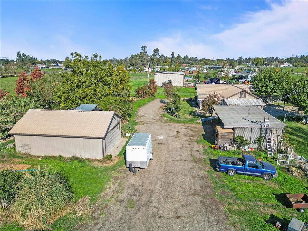 23707 North Graham Road Acampo, CA 95220 - Photo 22 of 37 an aerial view of a house with a garden and lake view