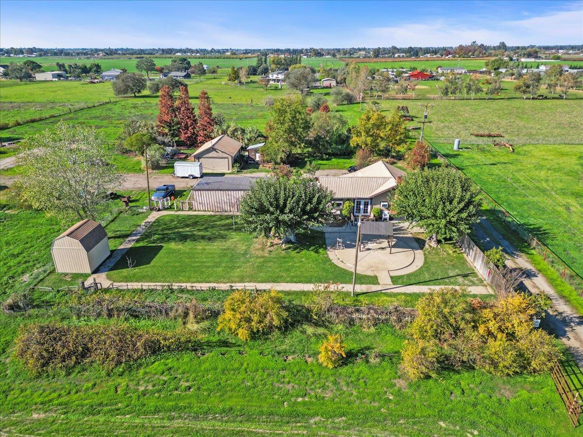 23707 North Graham Road Acampo, CA 95220 - Photo 31 of 37 a view of a garden with a lake