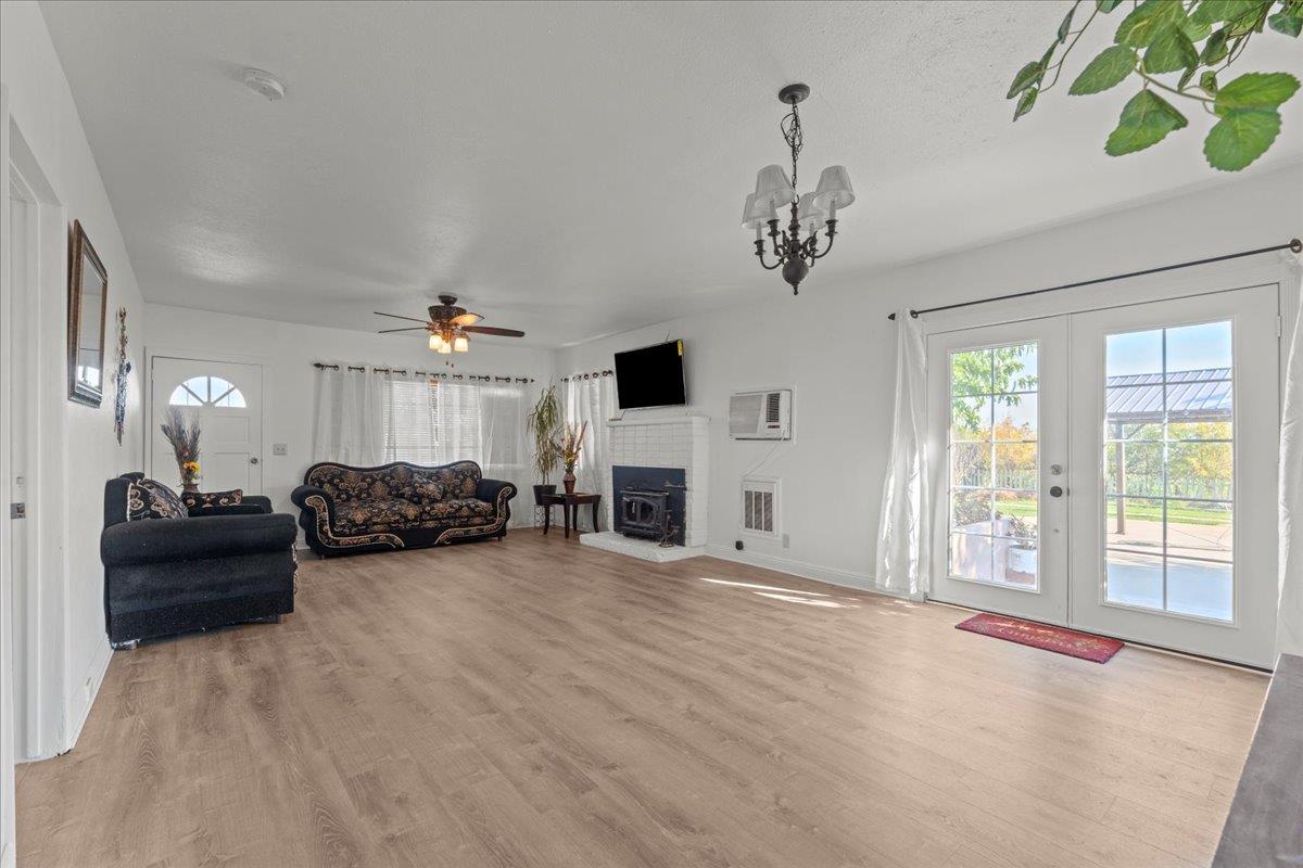 23707 North Graham Road Acampo, CA 95220 - Photo 6 of 37 a view of a livingroom with furniture and a fireplace