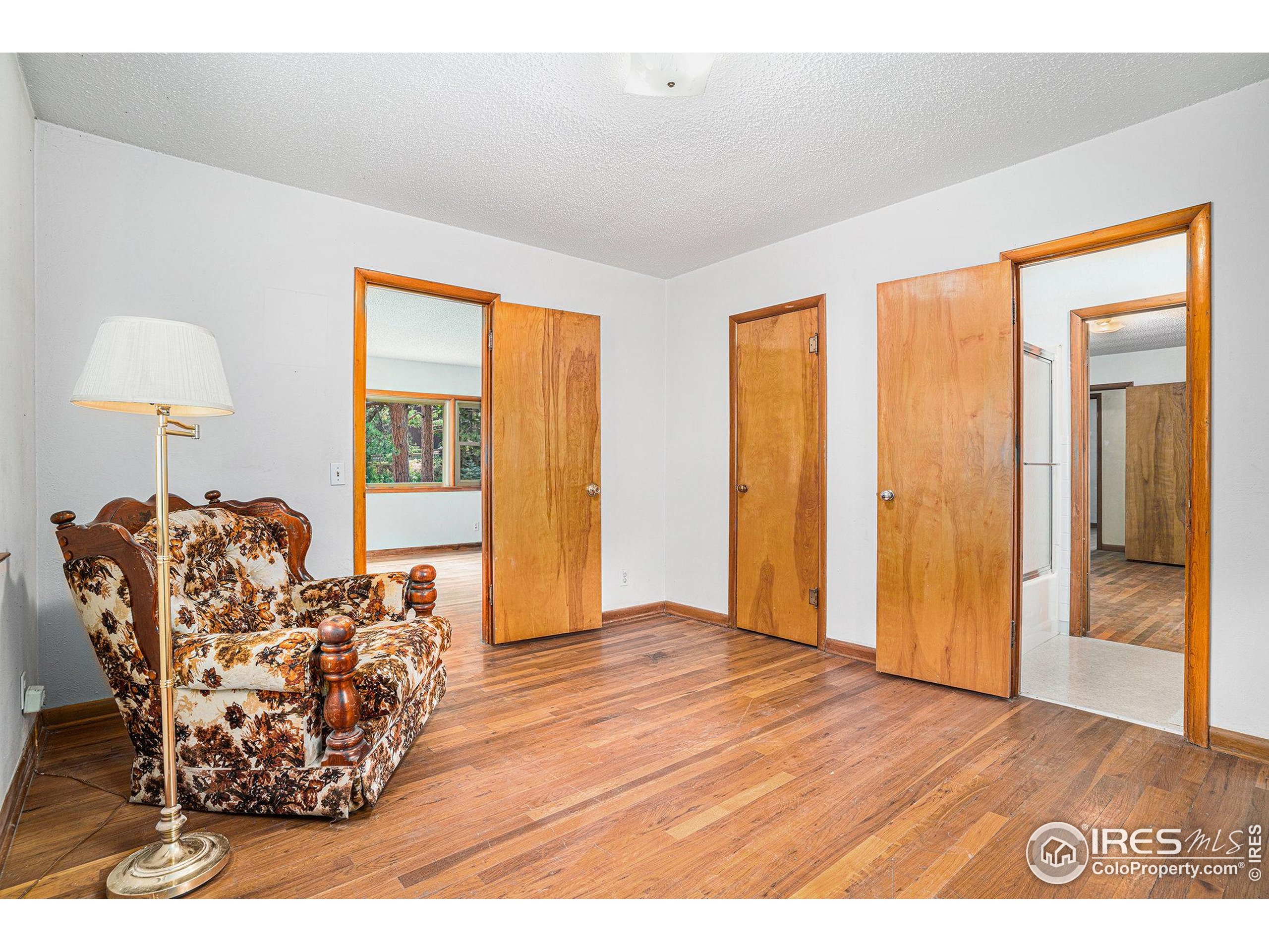143 Waltonia Road Drake, CO 80515 - Photo 13 of 30 a view of a livingroom with furniture and hardwood floor