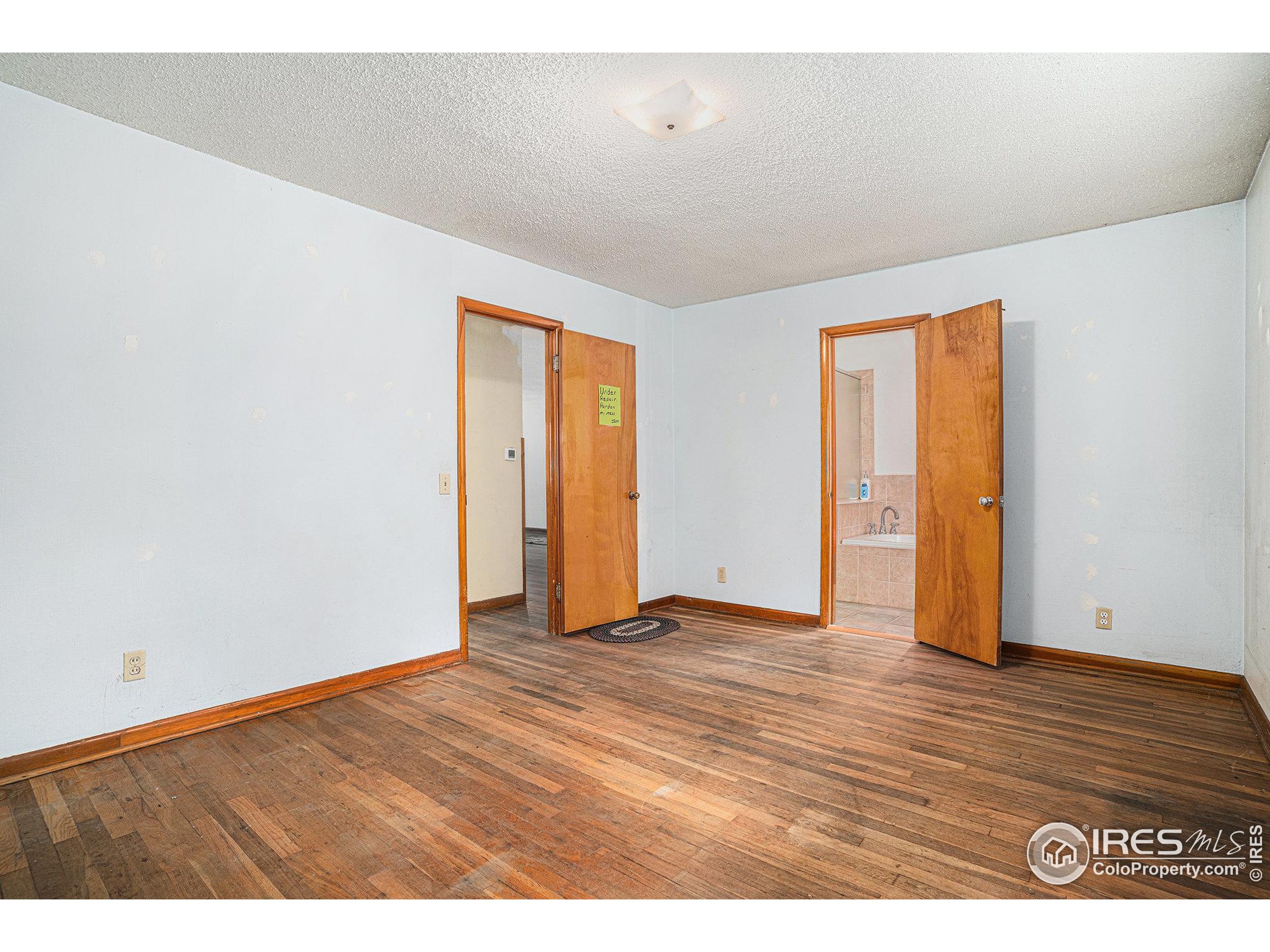 143 Waltonia Road Drake, CO 80515 - Photo 15 of 30 a view of an empty room with wooden floor