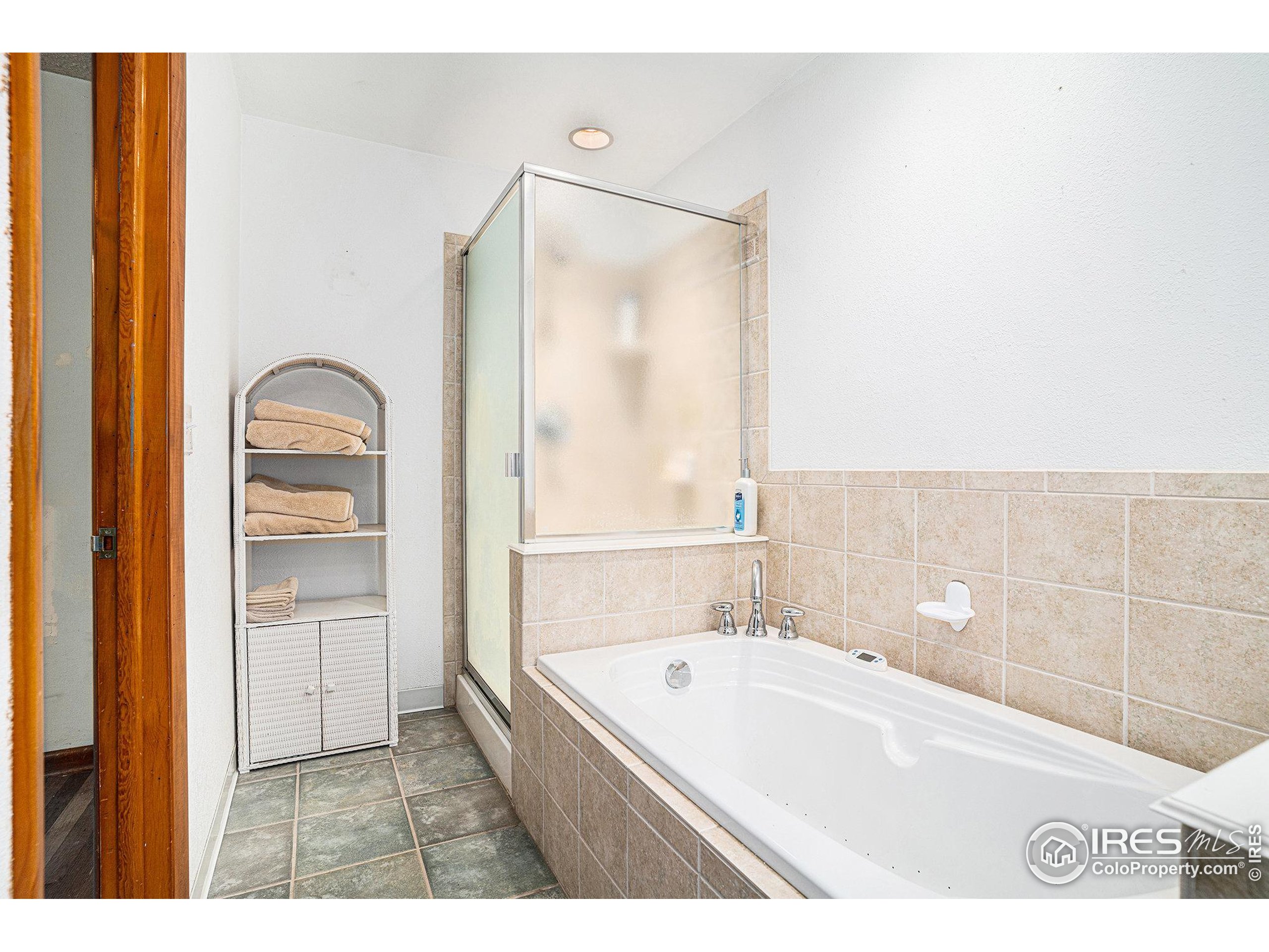 143 Waltonia Road Drake, CO 80515 - Photo 17 of 30 a bathroom with a bathtub and a shower