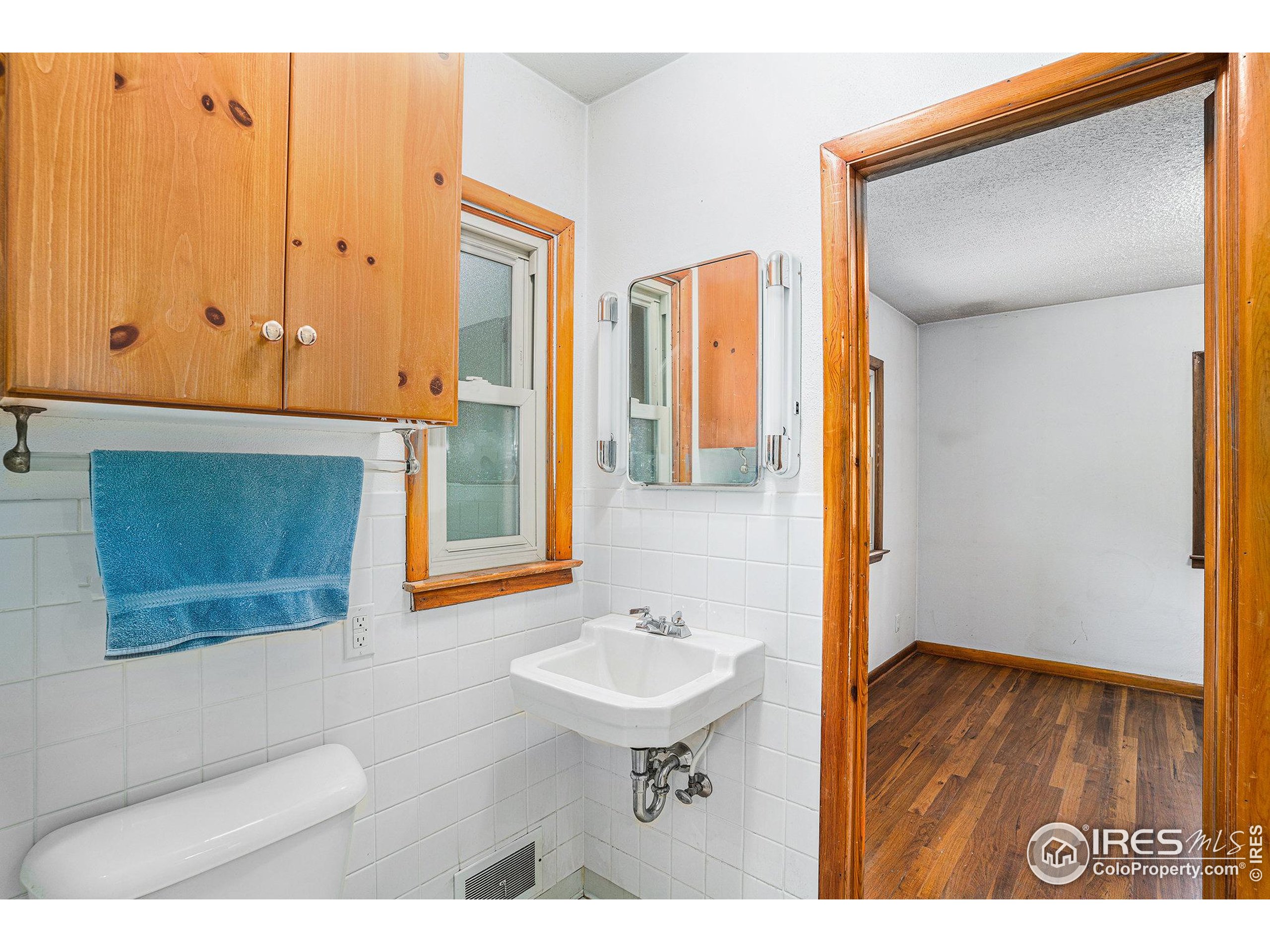 143 Waltonia Road Drake, CO 80515 - Photo 20 of 30 a bathroom with a sink and a mirror