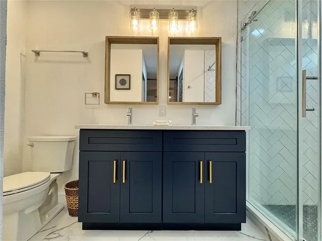 a living room with furniture a flat screen tv and wooden floor