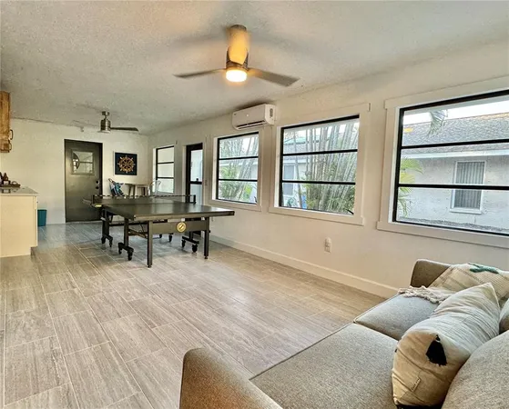 a kitchen with a cabinets and a stove with wooden floor