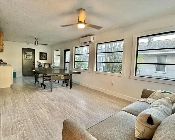 a kitchen with a cabinets and a stove with wooden floor