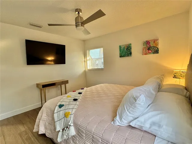 a bathroom with a sink a shower and a mirror