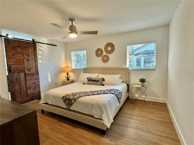 a bedroom with a bed and a walk in closet