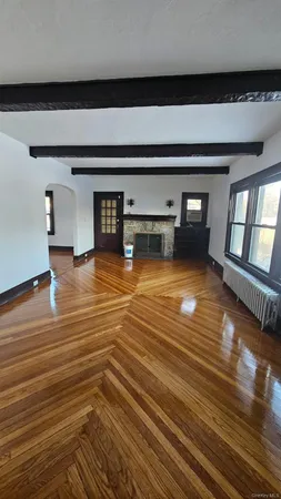 a view of a room with wooden floor
