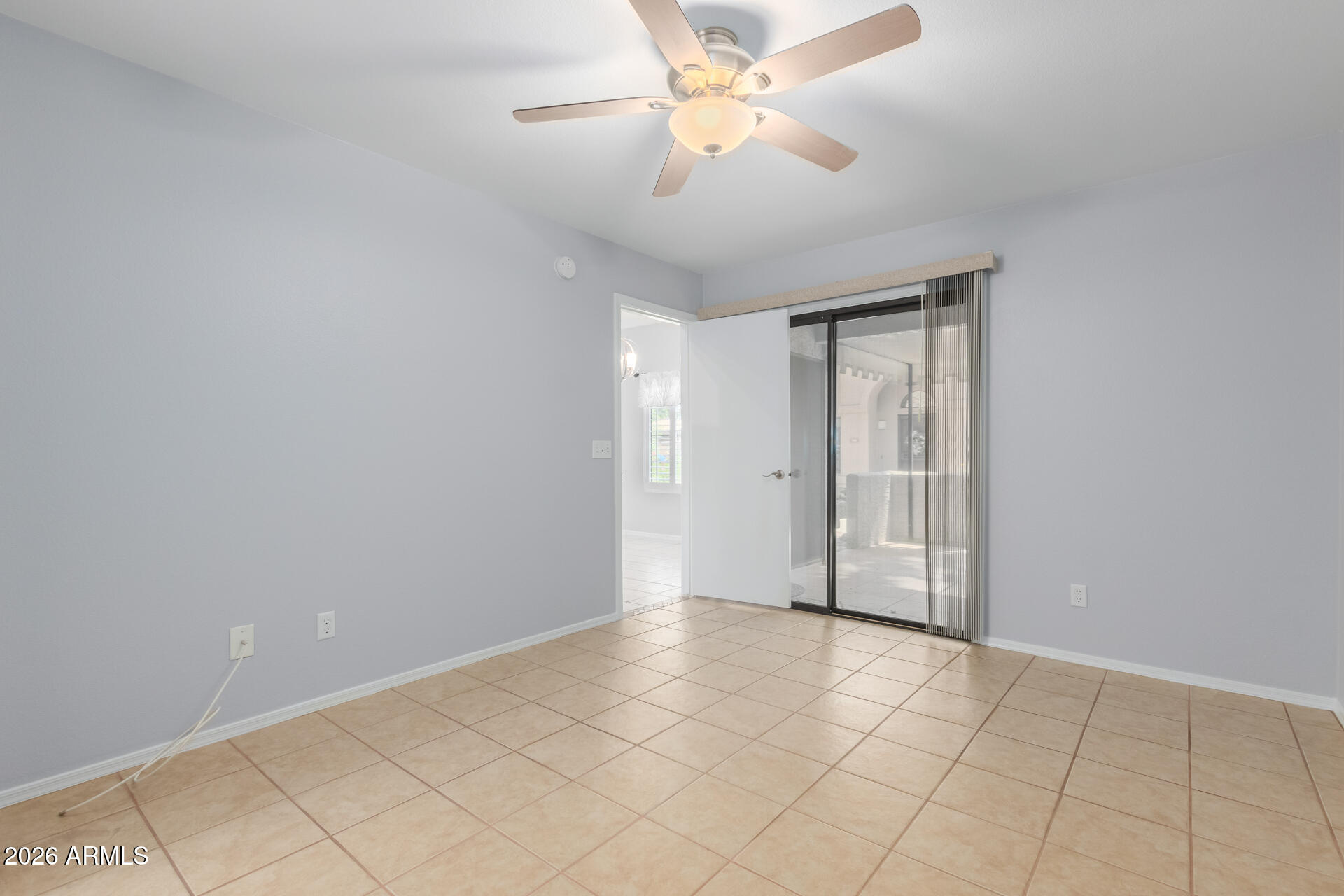 14300 West Bell Road, Unit 349 Surprise, AZ 85374 - Photo 11 of 32 a view of an empty room and a chandelier fan