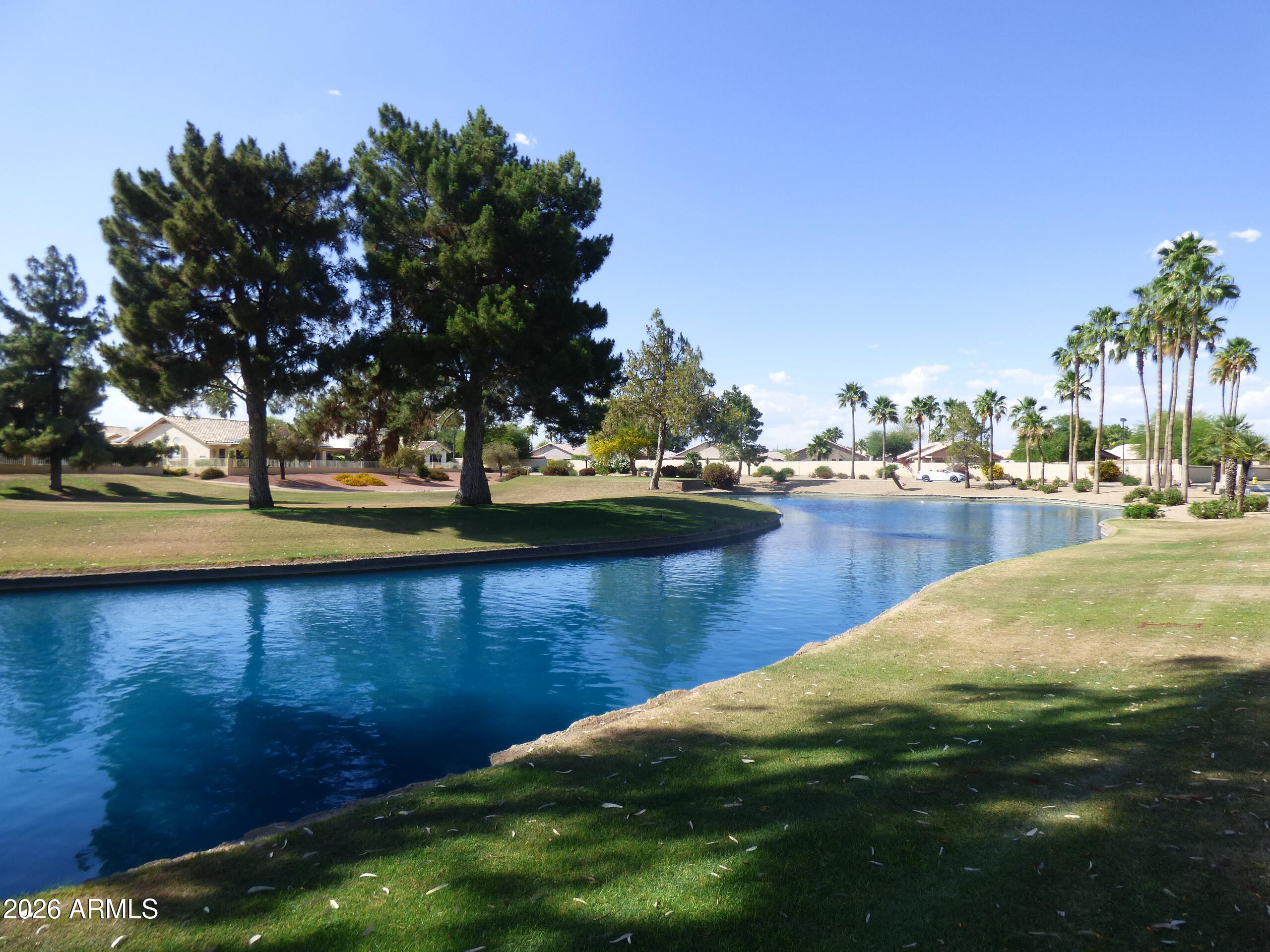 14300 West Bell Road, Unit 349 Surprise, AZ 85374 - Photo 27 of 32 a view of a lake with houses