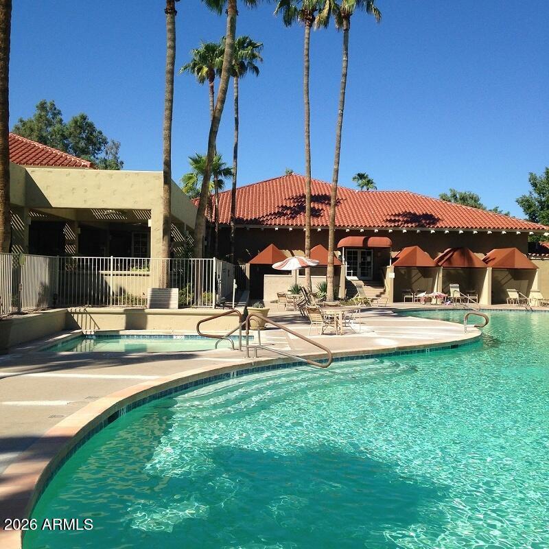 14300 West Bell Road, Unit 349 Surprise, AZ 85374 - Photo 31 of 32 a view of a house with swimming pool