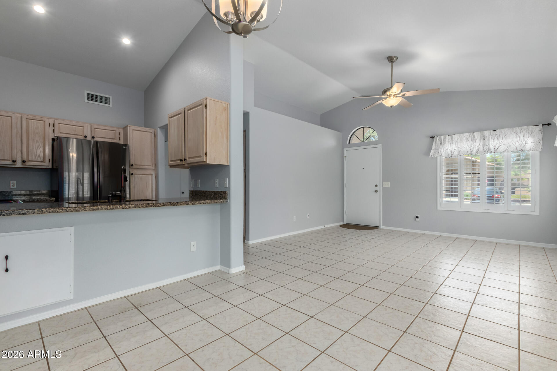 14300 West Bell Road, Unit 349 Surprise, AZ 85374 - Photo 4 of 32 a view of a kitchen with a sink and a refrigerator cabinets
