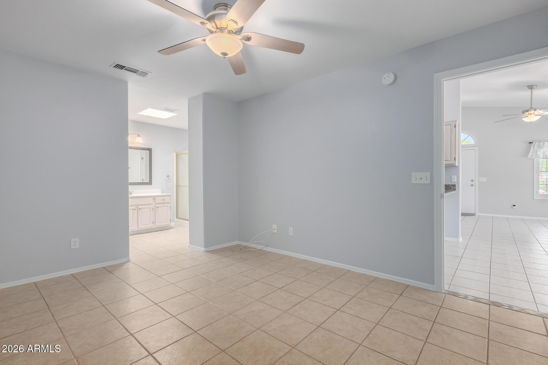 14300 West Bell Road, Unit 349 Surprise, AZ 85374 - Photo 10 of 32 a view of an empty room and chandelier fan