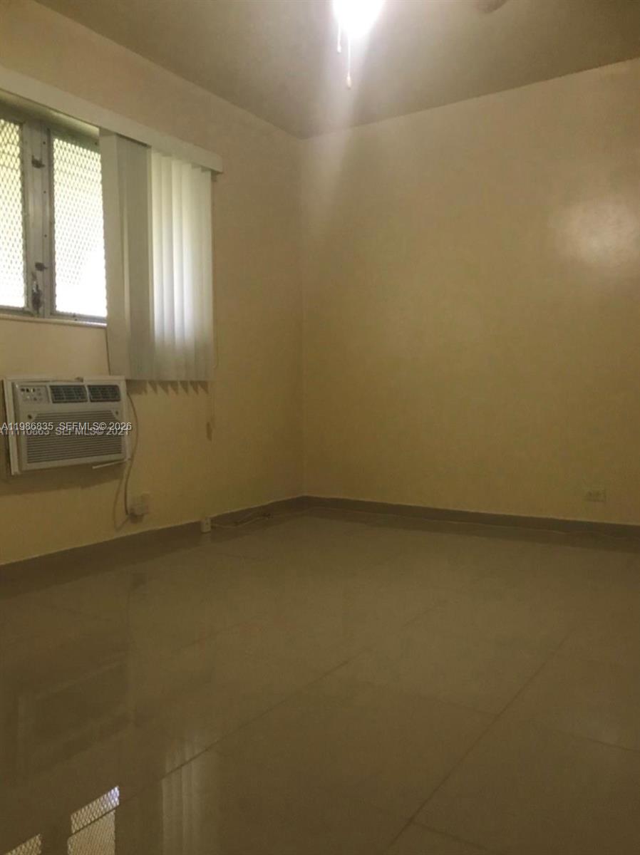 70 Northwest 77th Street, Unit 9 Miami, FL 33150 - Photo 11 of 13 an empty room with a empty space