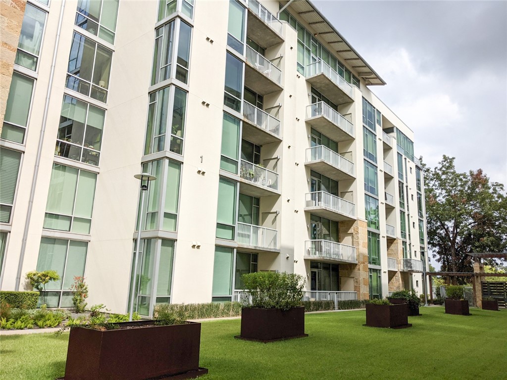 1600 Barton Springs Road, Unit 1407 Austin, TX 78704 - Photo 36 of 38 a front view of a building with a garden